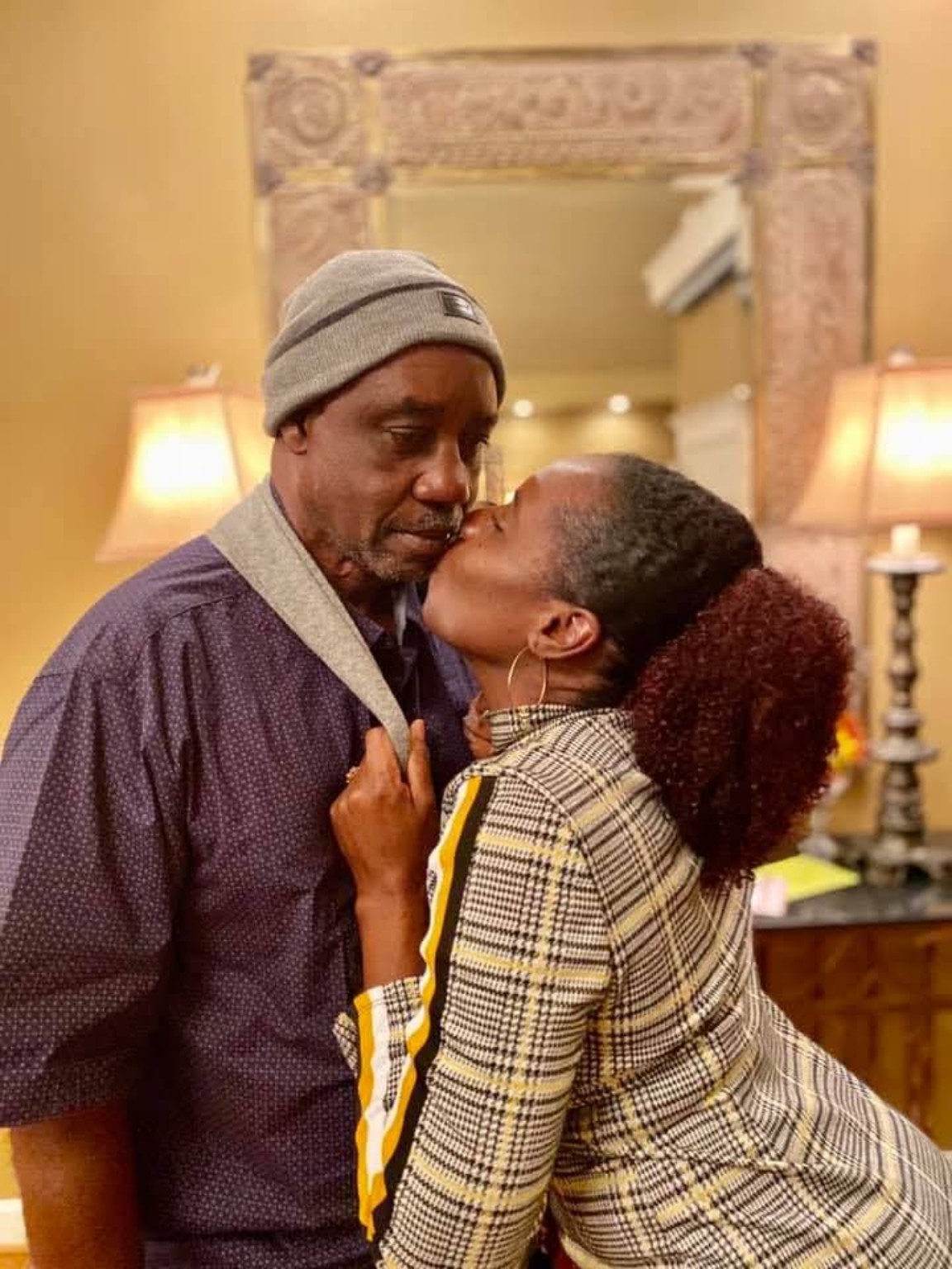 A daughter sharing an affectionate moment with her father